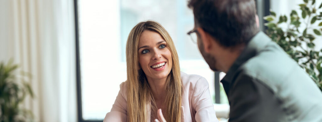 Smart business people working together with laptop while talking